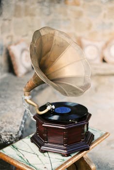 A classic gramophone with a vinyl record sits elegantly on a side table, showcasing vintage charm.