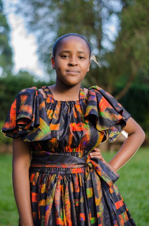 A Young Woman in a Printed Dress