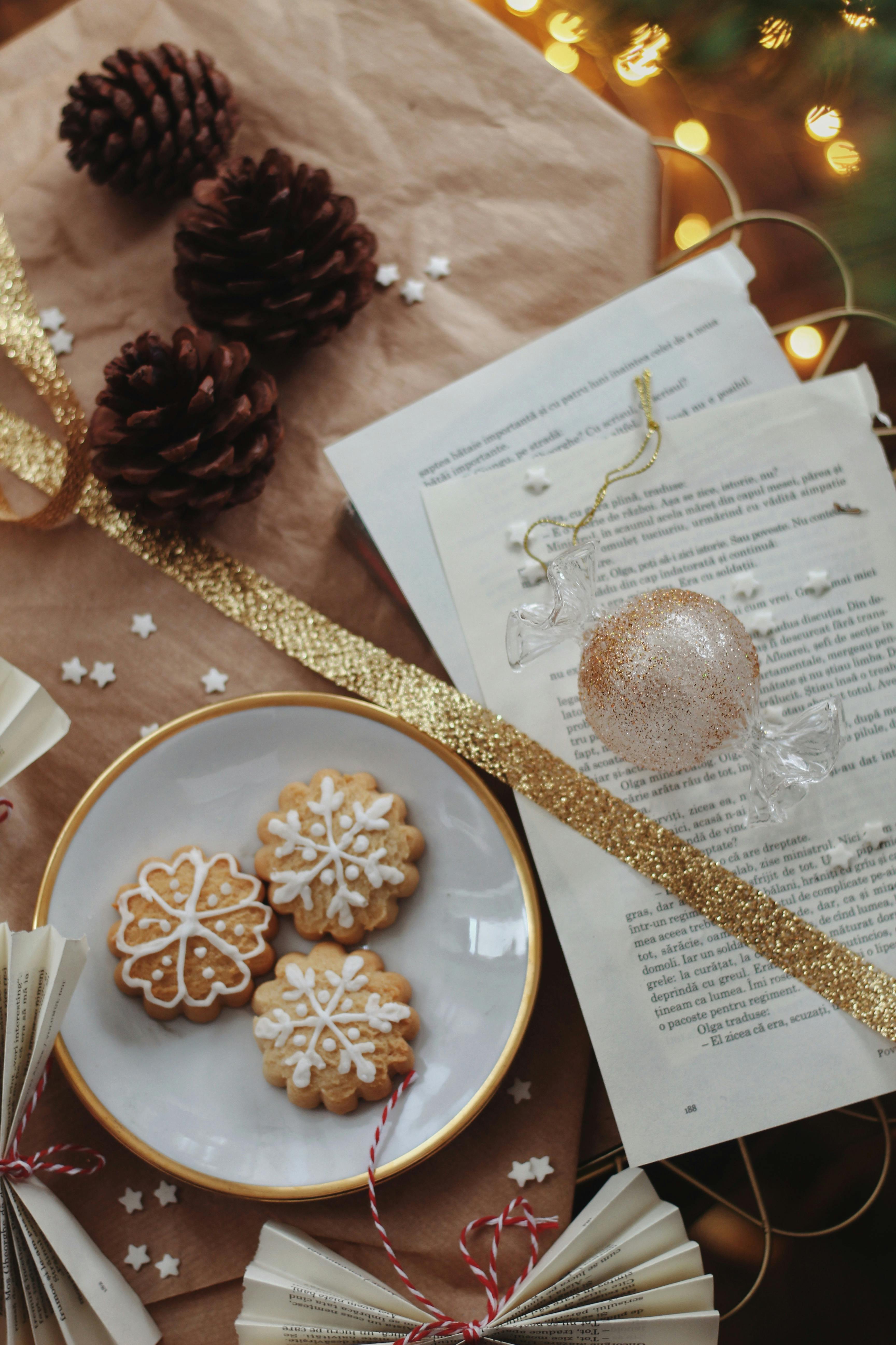 Close-up of snowflake cookies with festive pinecones and decorations, perfect for Christmas.