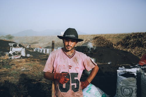 Portrait of Man Wearing Dirty Clothing