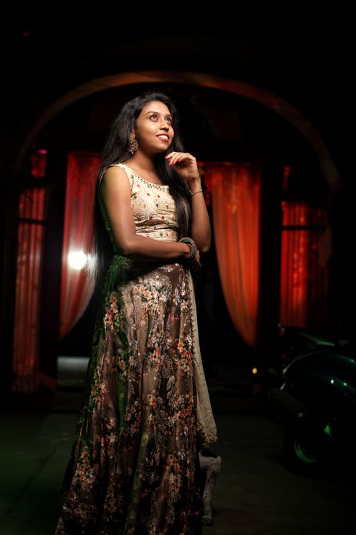 Free Stylish Indian woman in traditional attire posing gracefully indoors, exuding confidence and elegance. Stock Photo