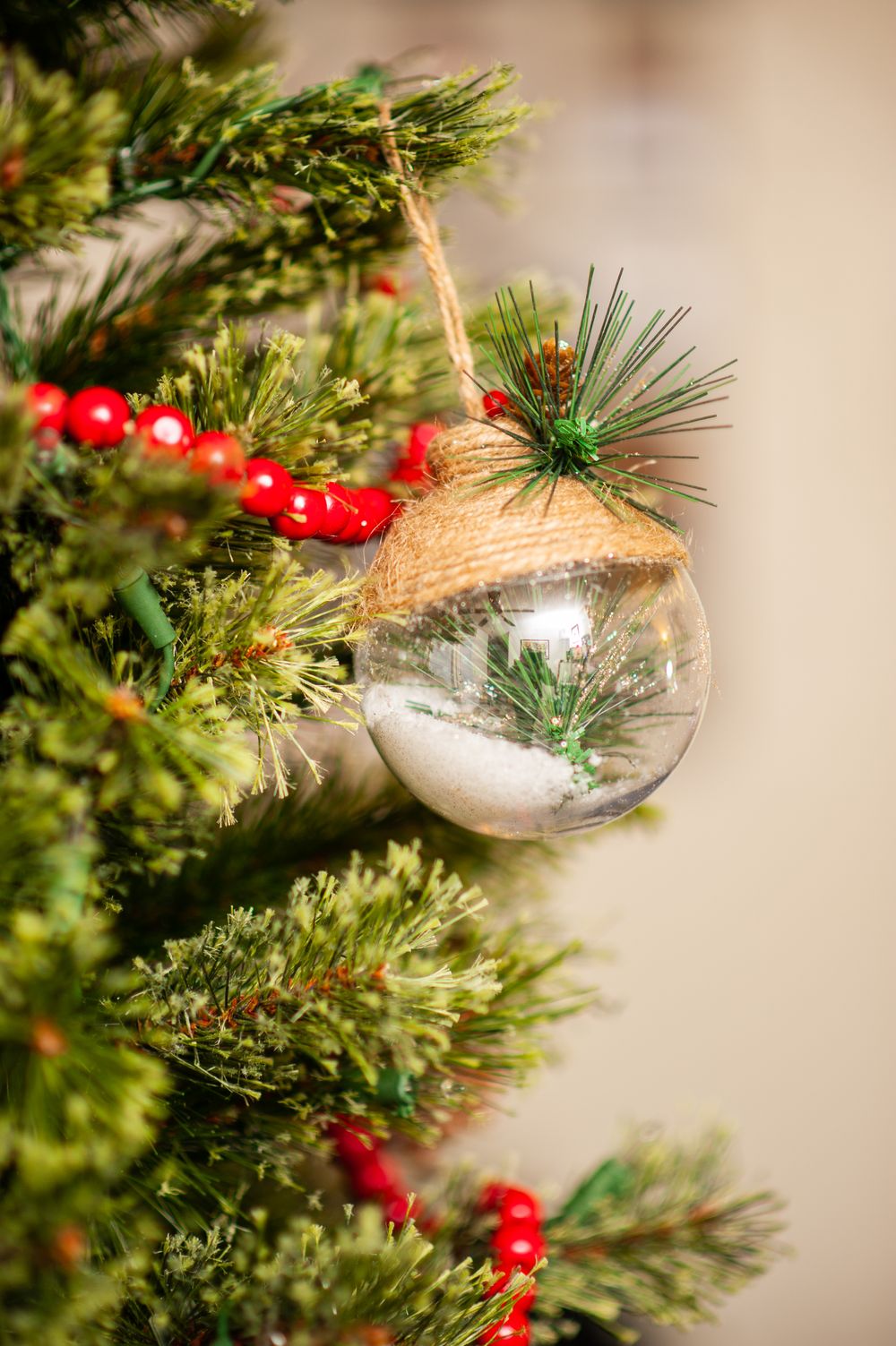 Realistic full 7ft pre-lit artificial Christmas tree, decorated