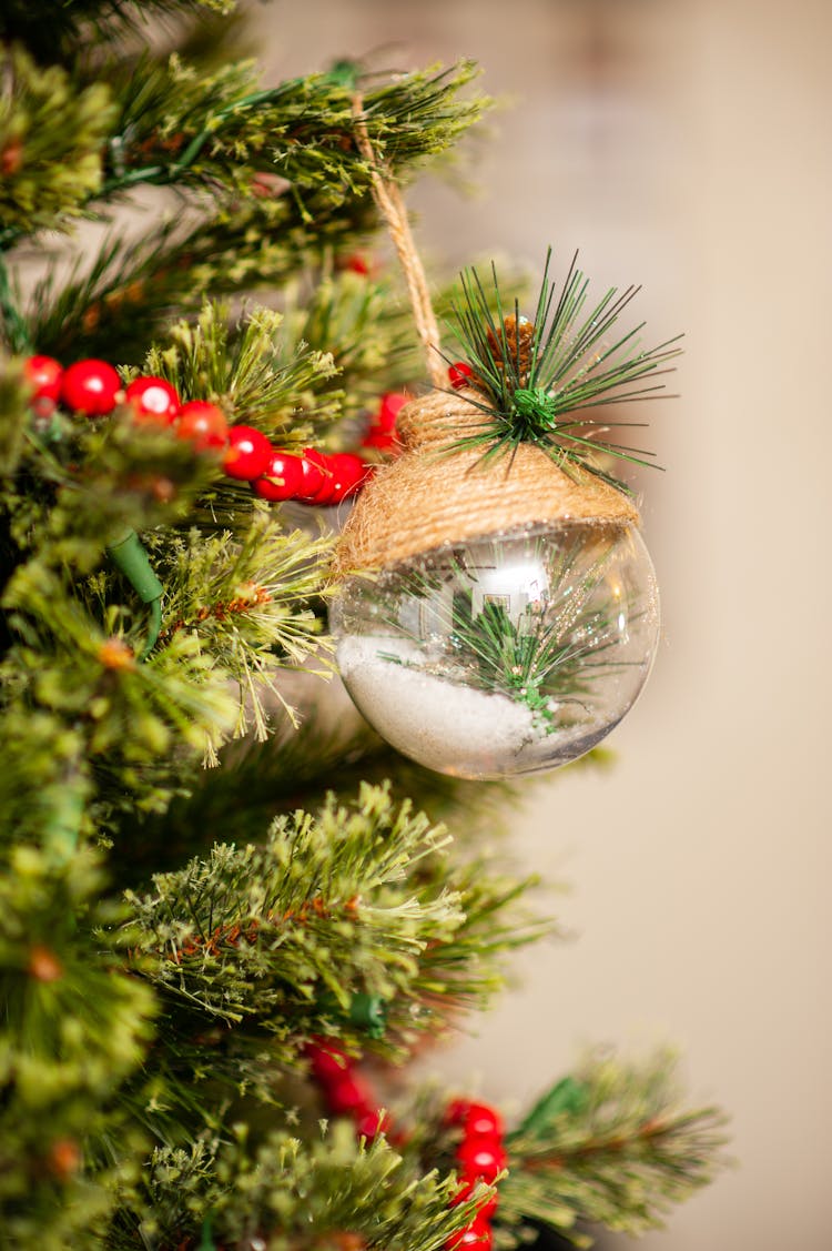 Transparent Ornament Hanging On A Christmas Tree