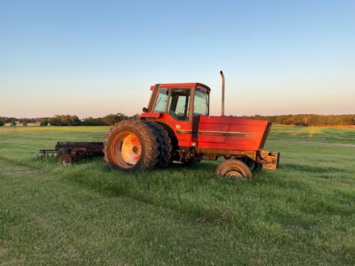 A Tractor on Green Grass Field
