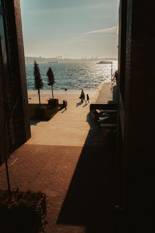City Alley at Dusk with Sea in the Background