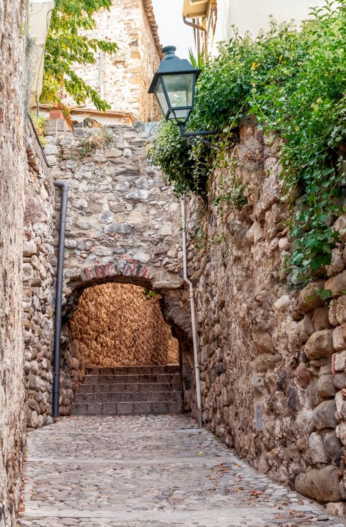 Free Explore the rustic charm of a cobblestone street in the medieval town of Besalú, Spain. Stock Photo