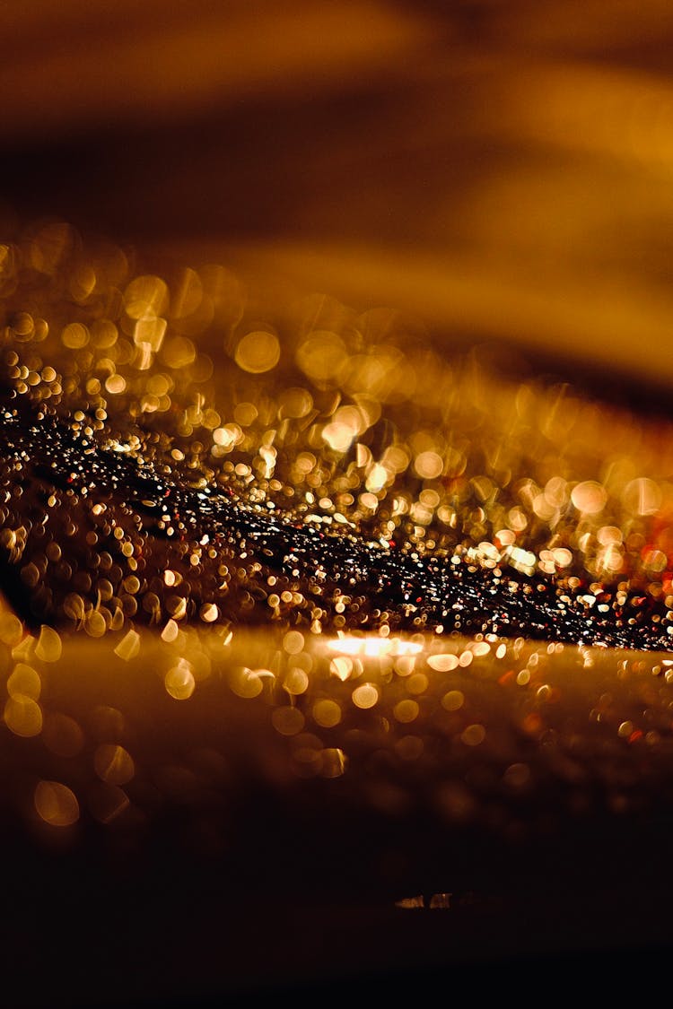 Close-Up Shot Of A Sparkling Gold Glitter