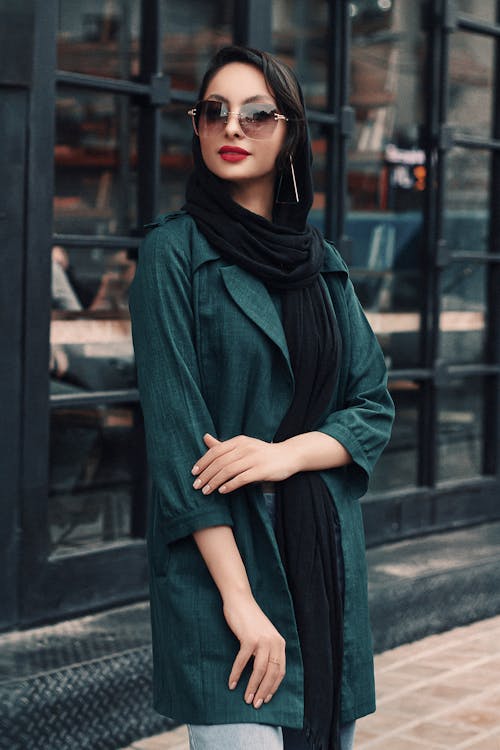 Portrait of a Woman in Black Scarf and Green Jacket