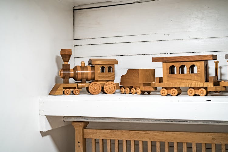 A Wooden Toy Train On A Shelf