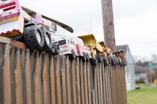 Vintage Toys on a fence