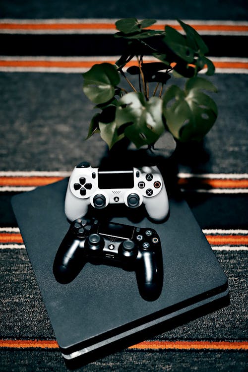 Composition of Two Game Controllers and a Plant