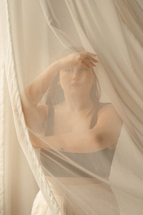 Woman Behind White Curtain 