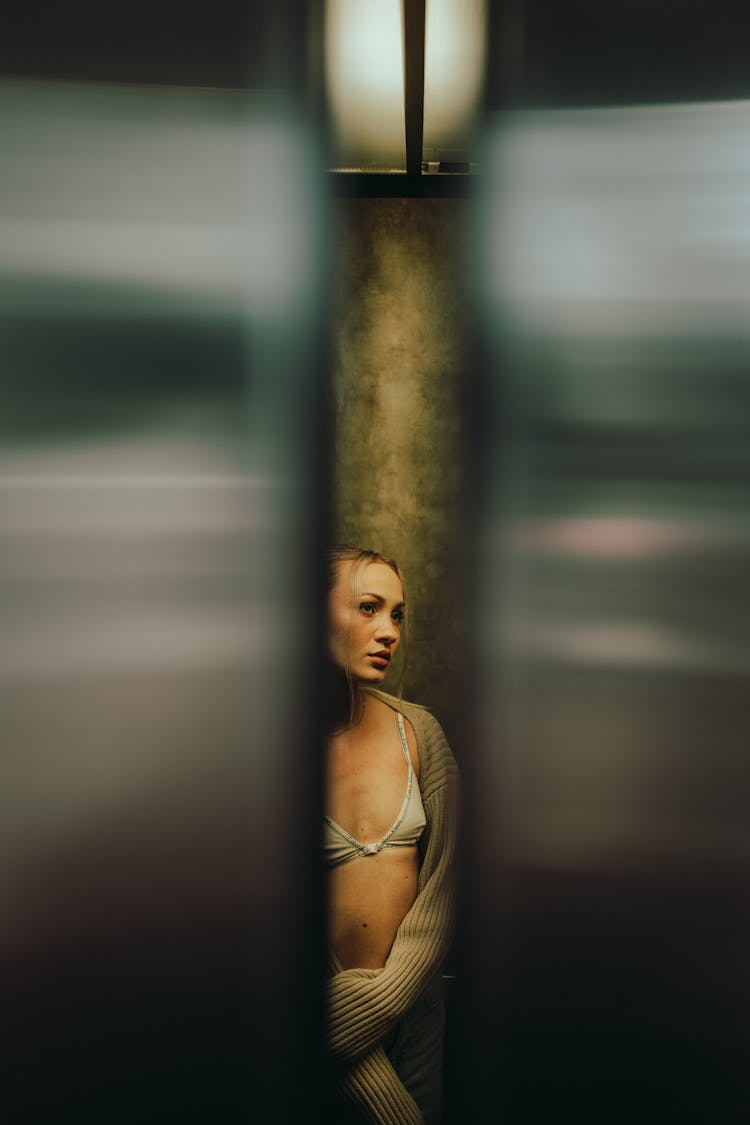 Woman In Elevator Wearing Bra