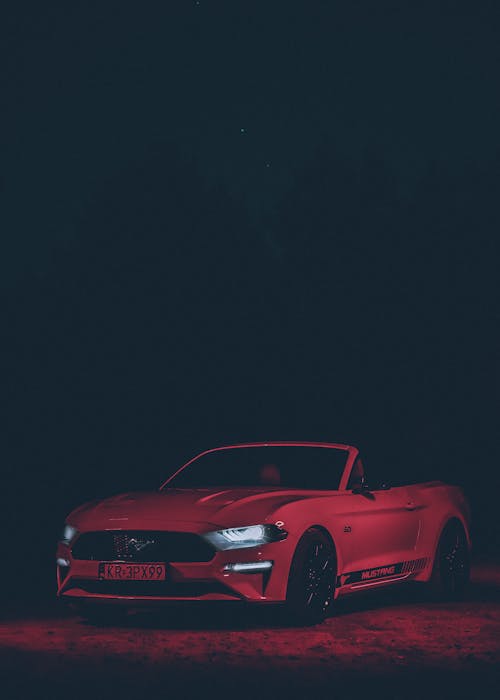 Low Light Photography of Red Mustang