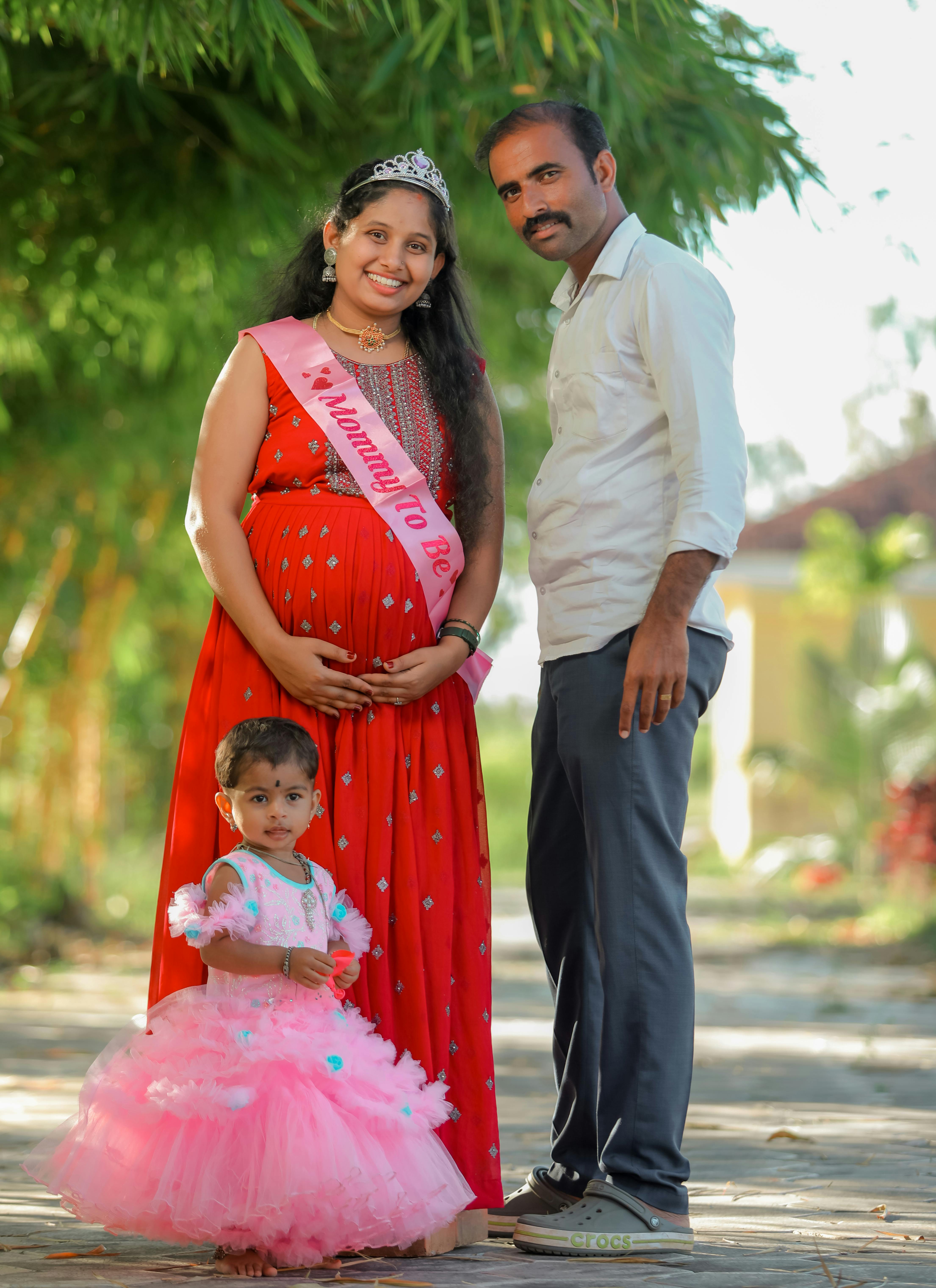 a happy family standing on the street