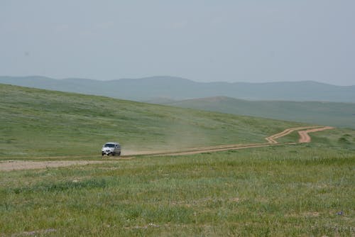 Car Running on a Rural Road