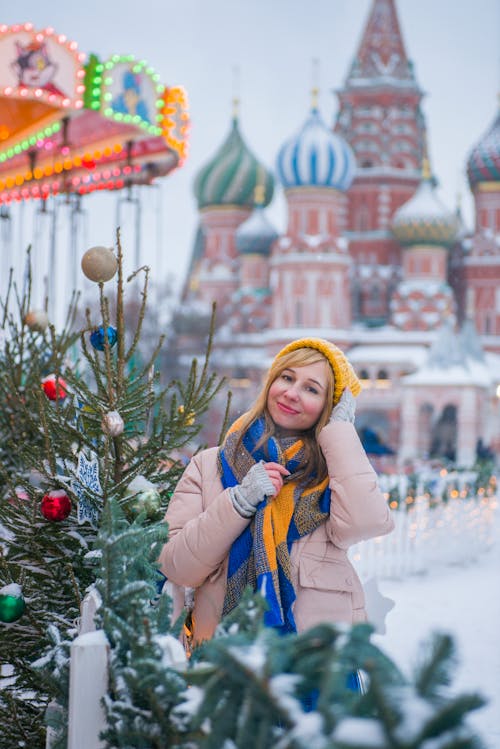 Woman Posing with Orthodox Basilica behind in Winter