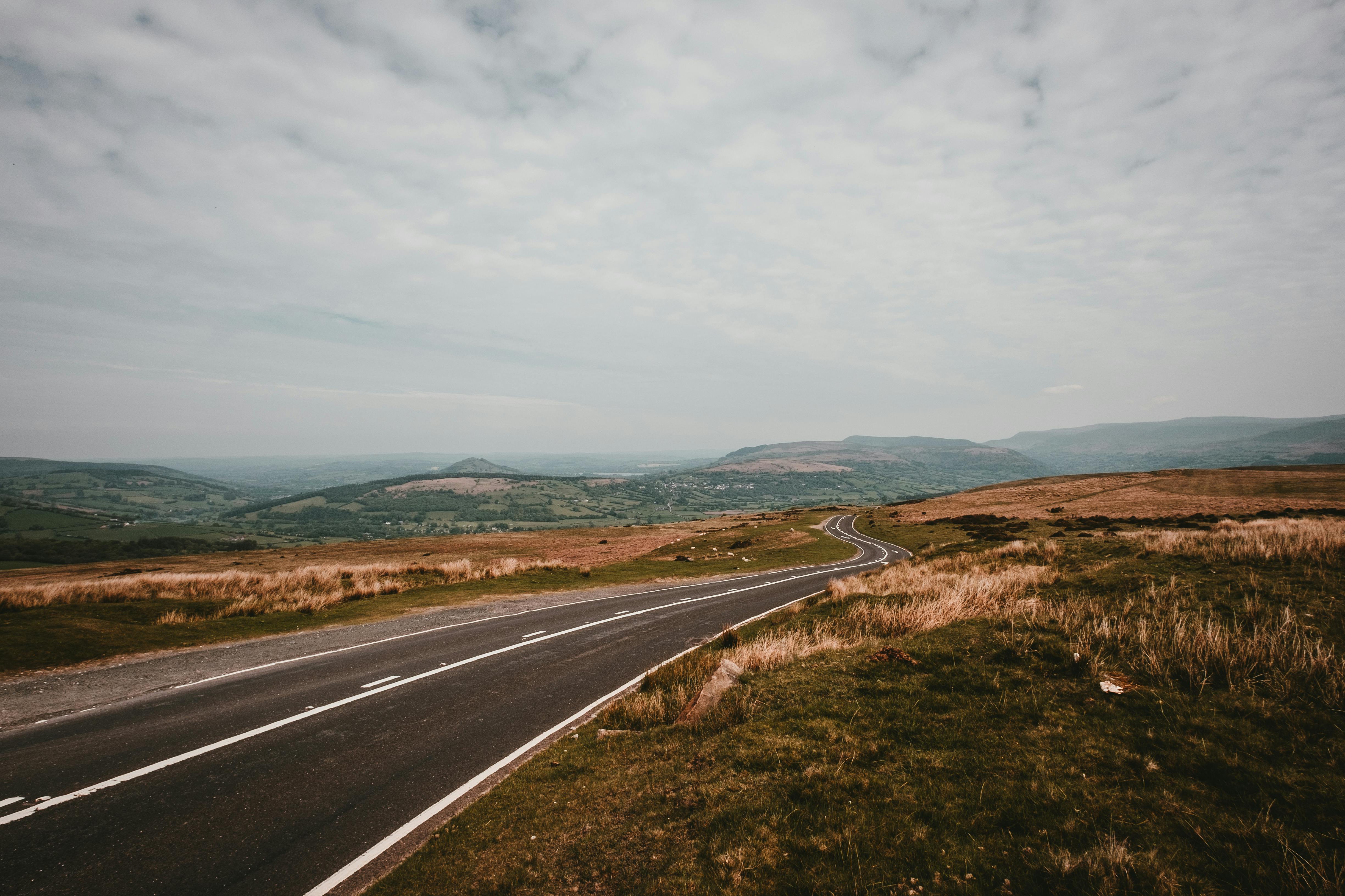 Beautiful scenic view of a winding road in Brecon Beacons National Park, Wales.