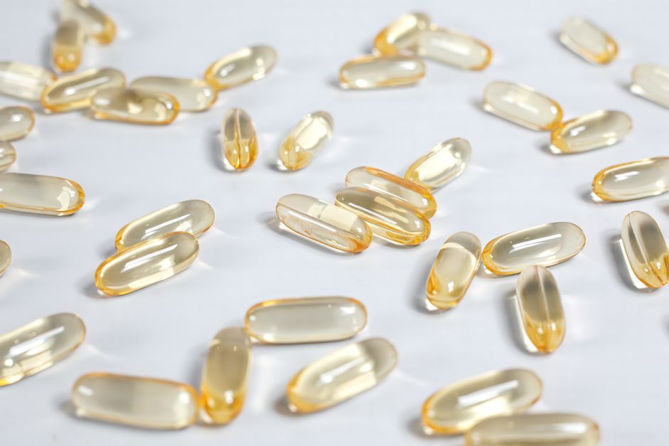 Softgel capsules on a white surface