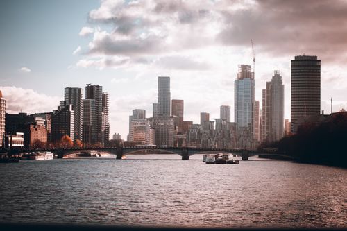 Free A captivating view of London's skyline over the River Thames, highlighting modern skyscrapers and urban landscapes. Stock Photo