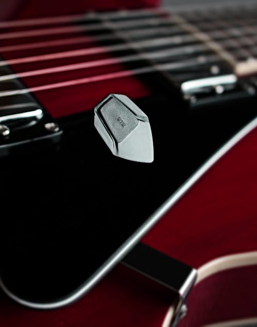 A Guitar Pick on the Pickguard