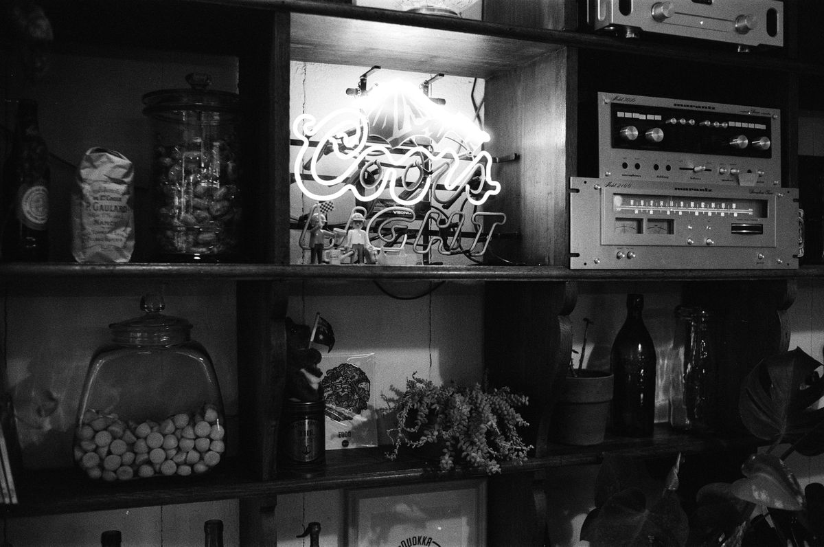 Vintage wooden shelving with retro decor and audio equipment