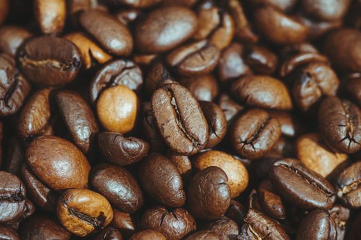 Close-up shot of perfectly roasted coffee beans showcasing their texture and color.