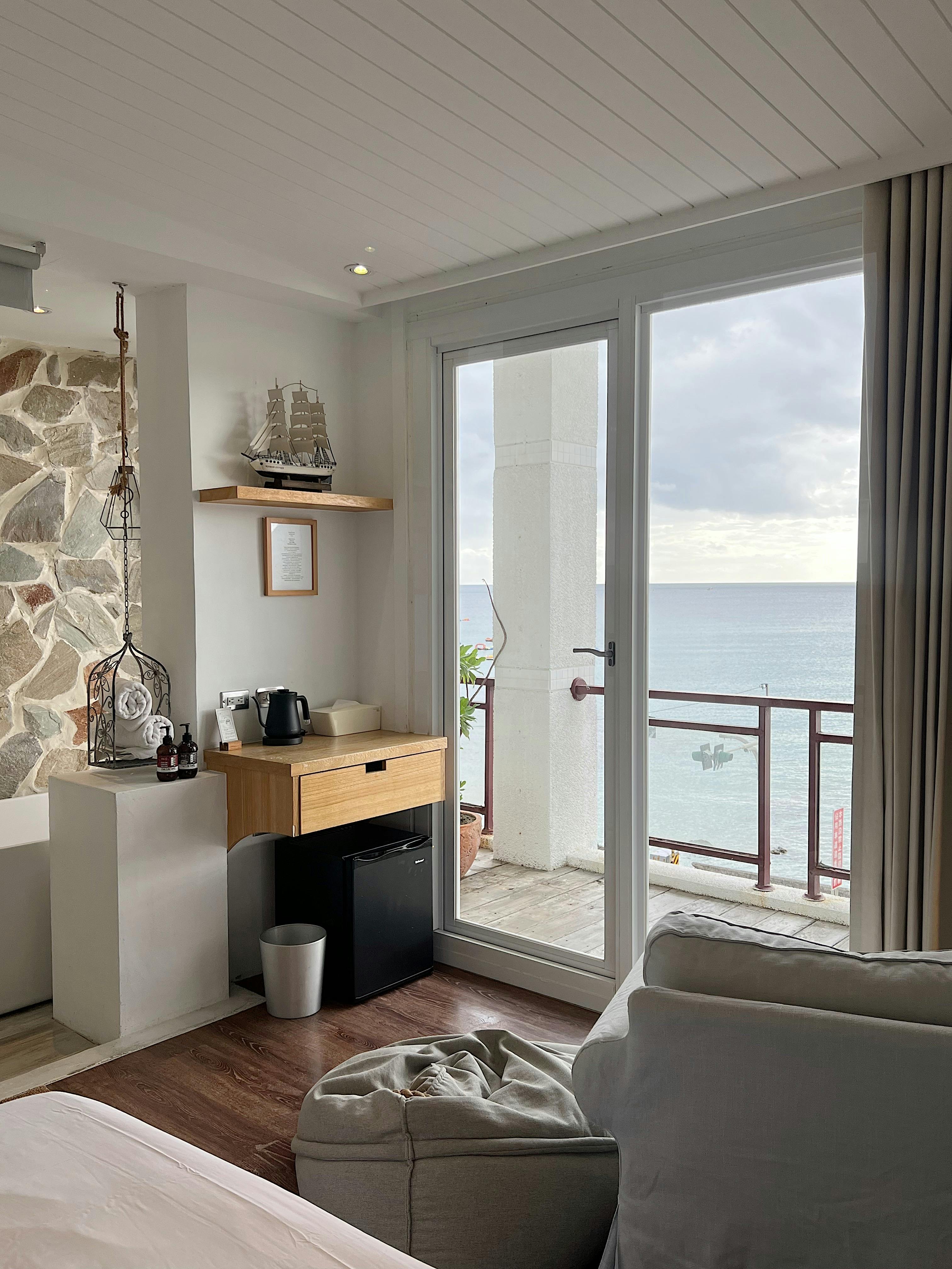 an interior space with wooden floors and sliding doors.