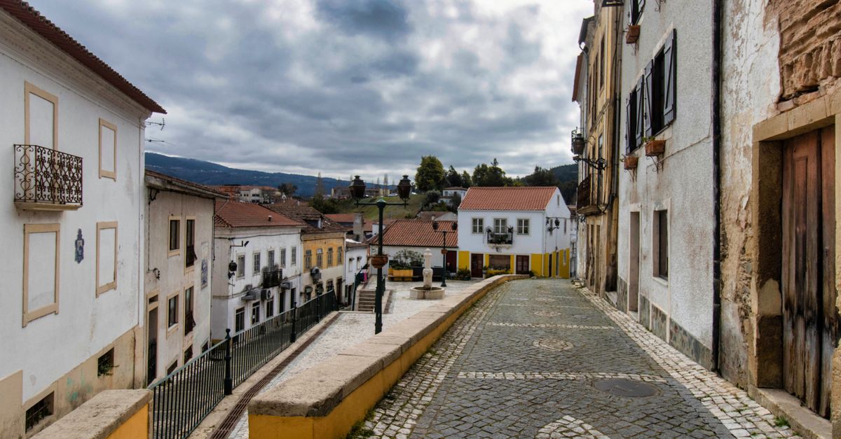 empty cobblestone street in small European town at sunrise