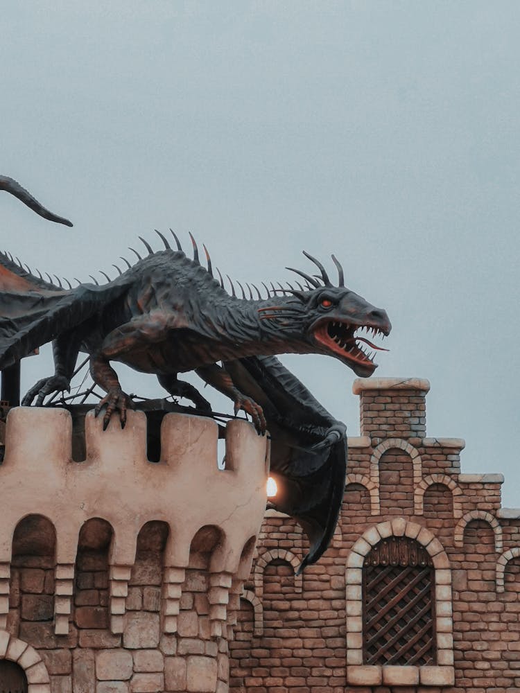 Statue Of A Dragon On The Castle Tower