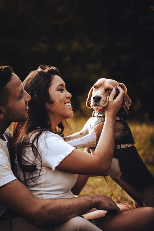 Couple Playing with a Dog 