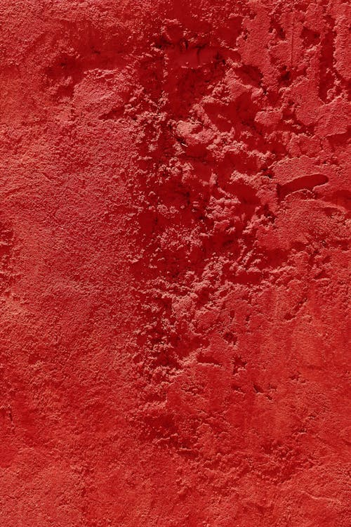 Close-Up Photo of Red Concrete Wall