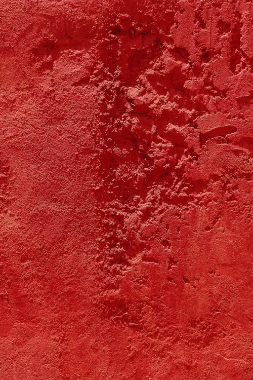 Close-Up Photo of Red Concrete Wall