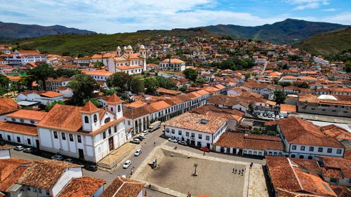 Free Experience the vibrant aerial view of historic Mariana, Minas Gerais, showcasing its red-tiled roofs and colonial architecture. Stock Photo