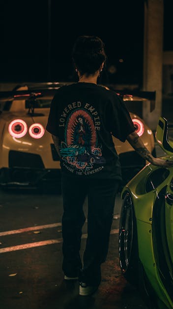 Woman Standing near Supercars at Night · Free Stock Photo
