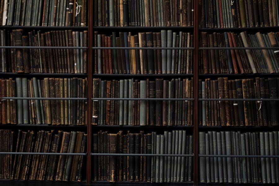 Vintage books lining the shelves of a library