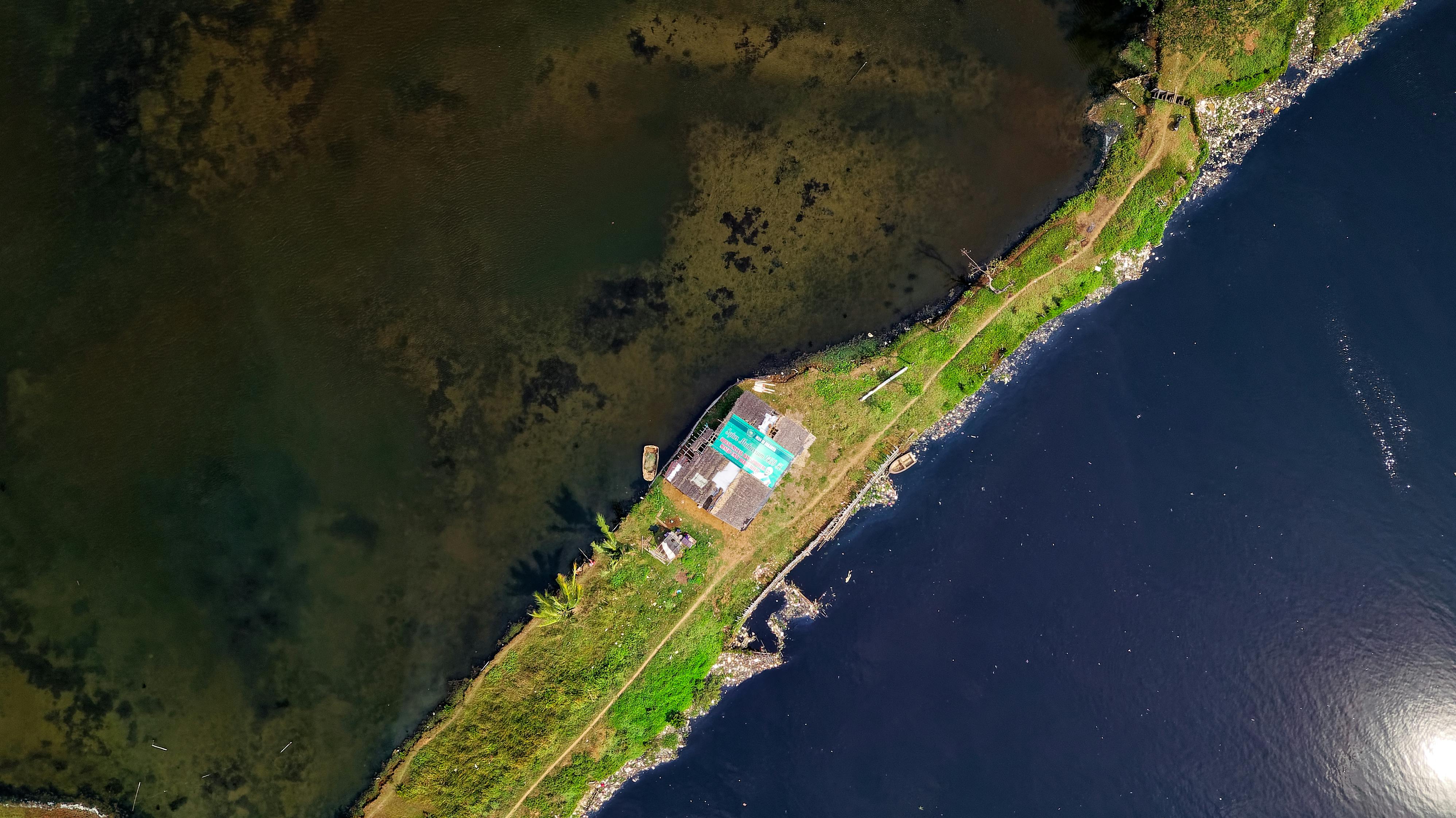 satellite view of land beside body of water