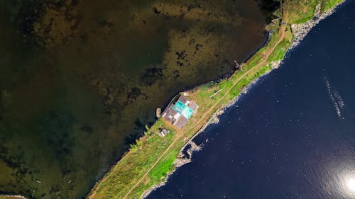 Satellite View of Land Beside Body of Water