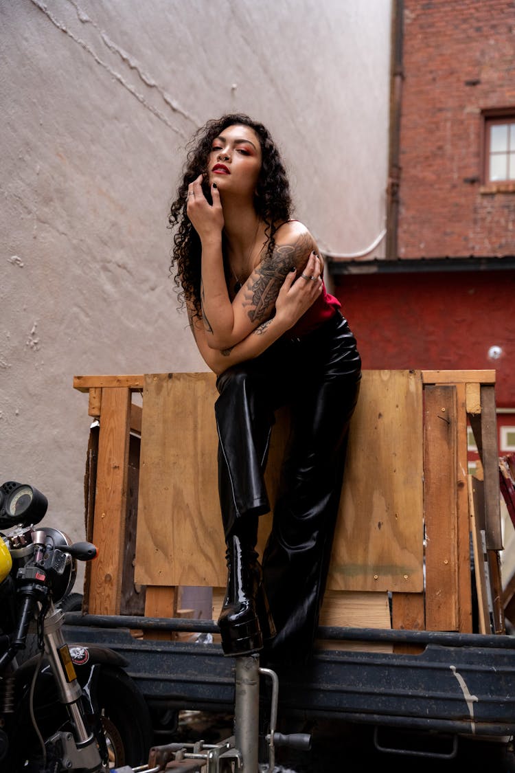 Woman Standing On A Vehicle 