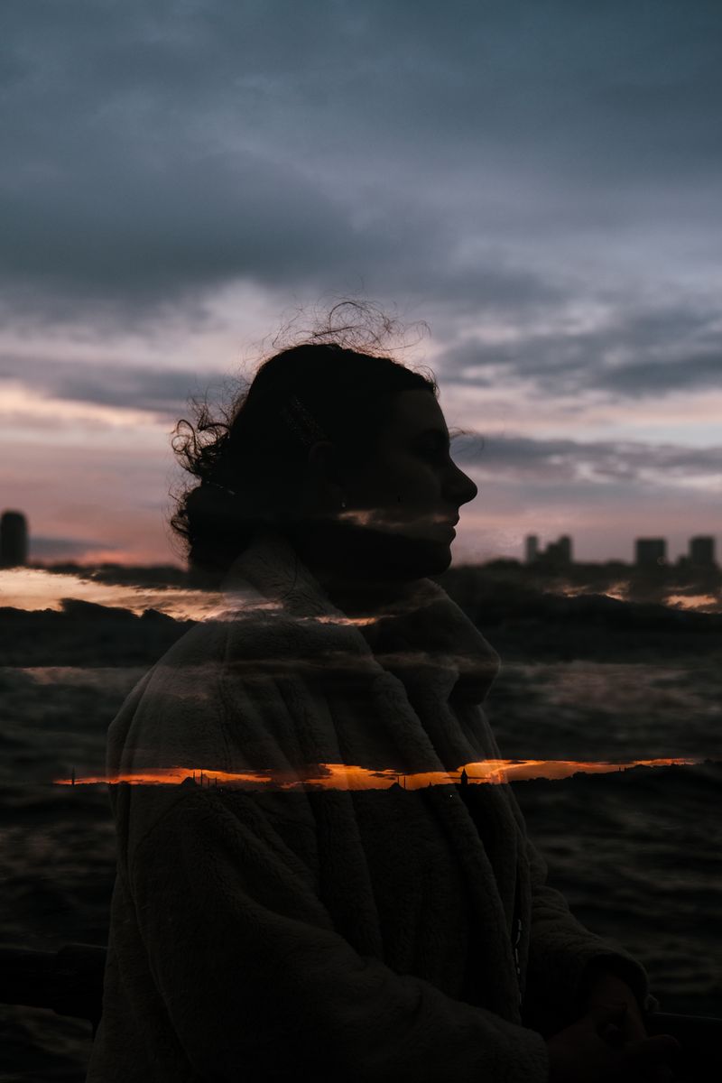Figure at dusk against a clouded horizon — photo by Amine İspir on Pexels