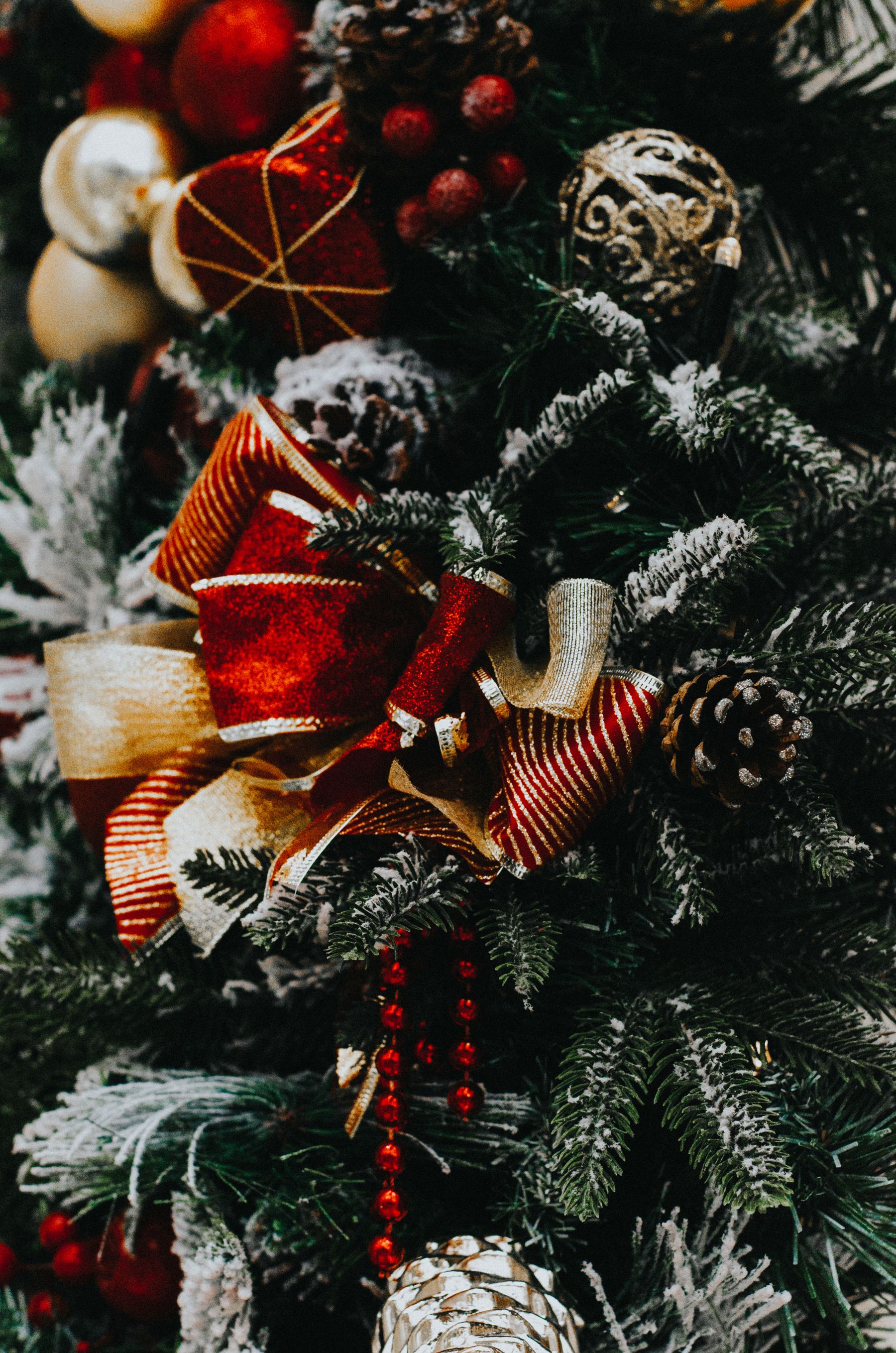 Close-up of a decorated tree with mixed size ornaments