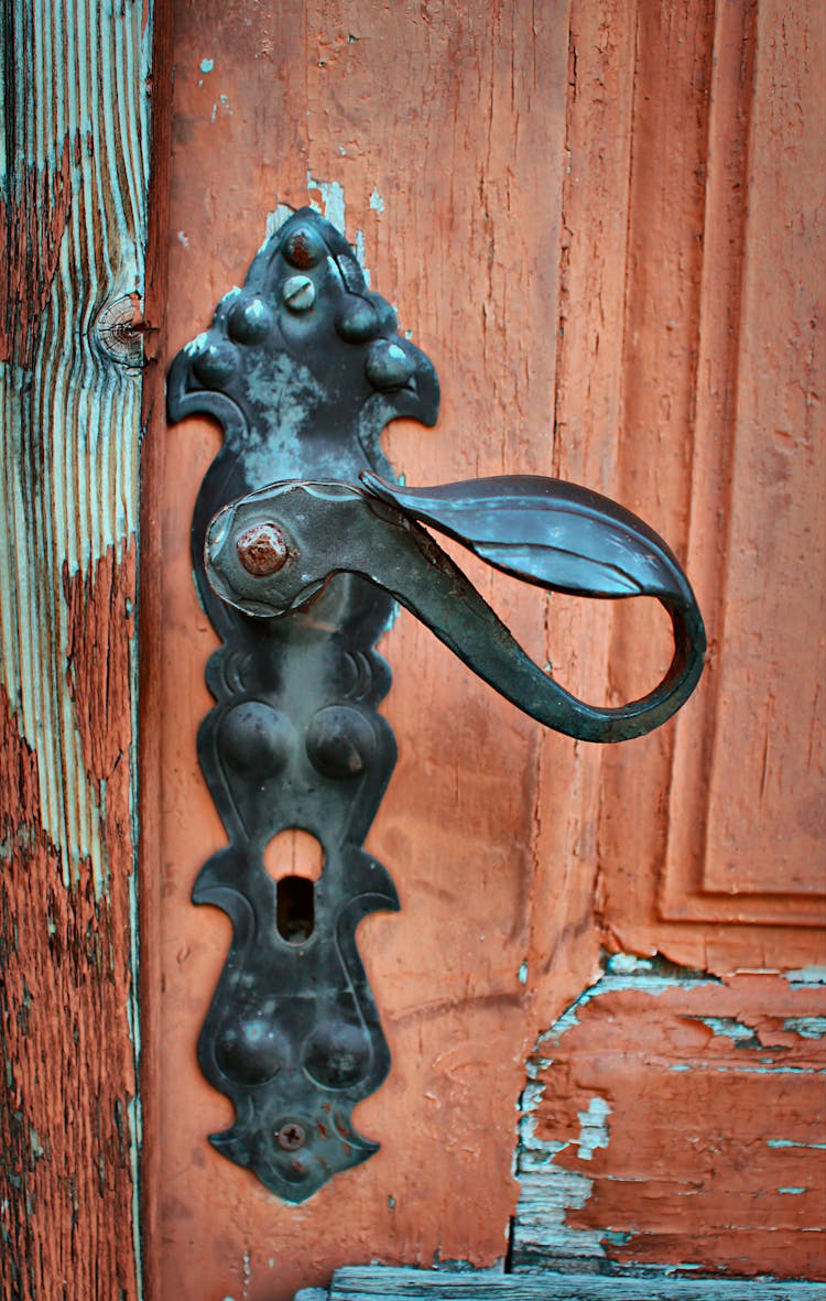 A Metal Door Handle In Close-up Photography