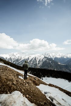 A lone hiker explores the snowy Kackar Mountains in Rize, Türkiye, during winter.