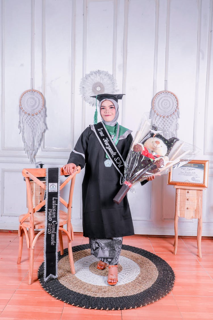 Rewarded Woman In Graduation Gown 