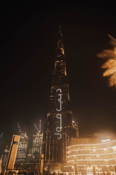 Dramatic night view of the illuminated Burj Khalifa in Dubai, showcasing the vibrant city skyline.