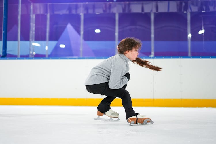 Girl Skating On Ice Rink