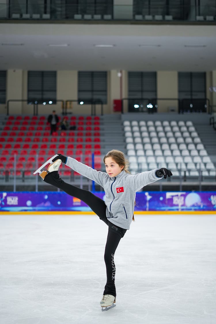 Girl Skating On Ice Rink