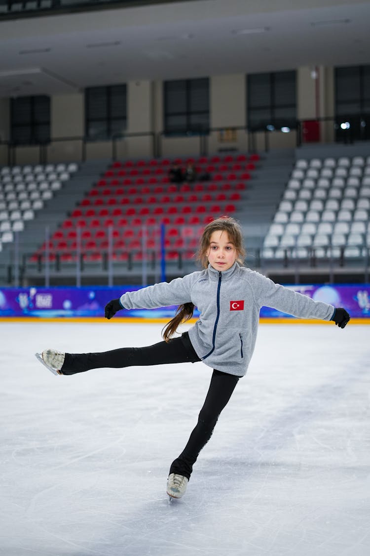 Girl Skating On Ice Rink