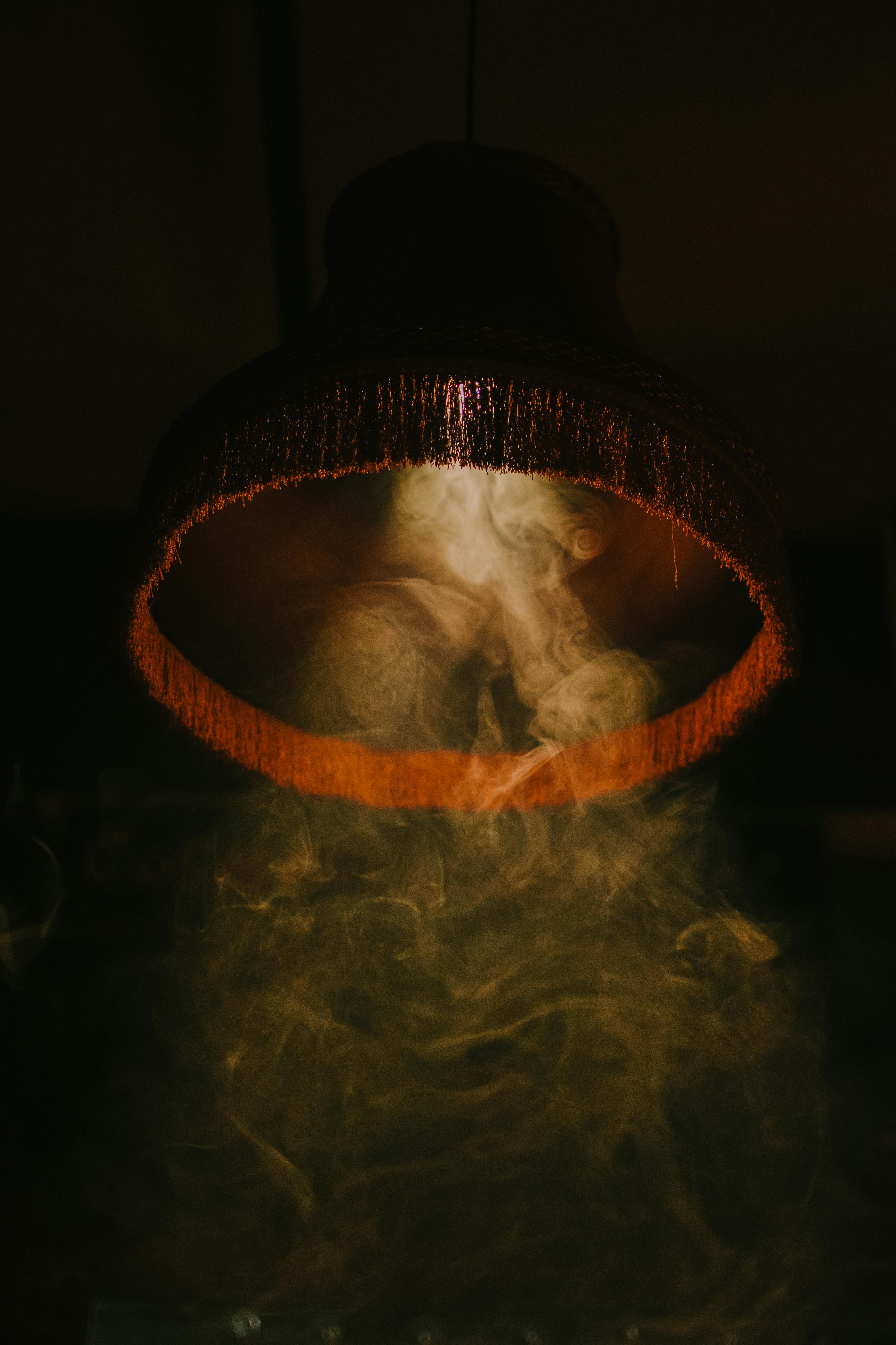 a lamp with smoke coming out of it