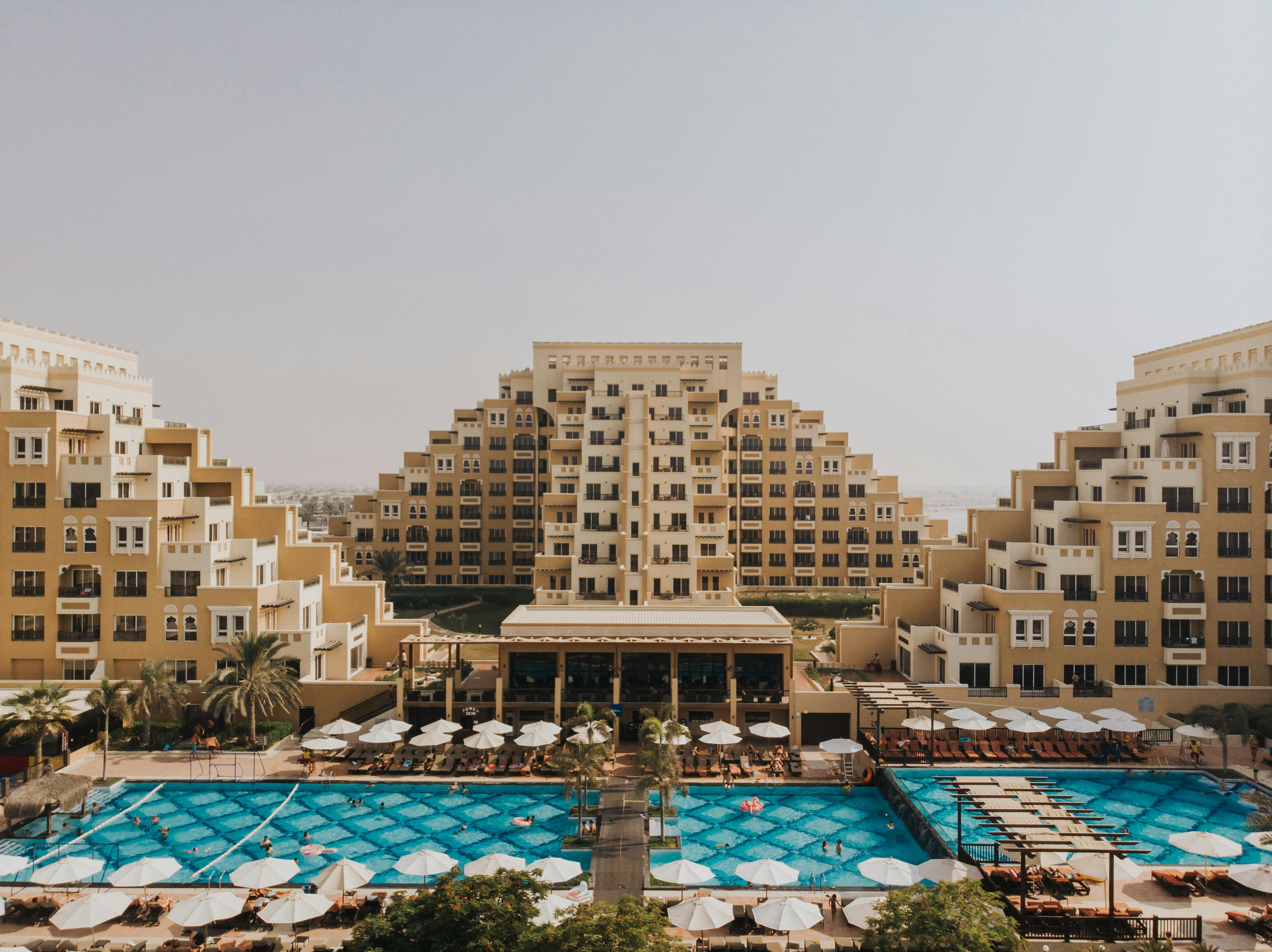 the pool and resort at the marina hotel in dubai